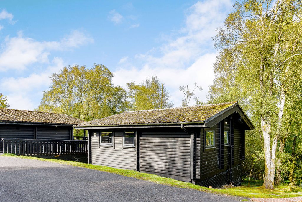 Elf Kirk lodge at Kielder Waterside. The single story lodge from the outside